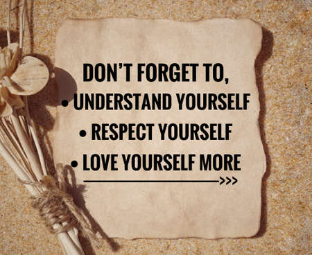 Motivational and inspirational quote - âDonât forget to understand yourself, respect yourself, love yourself moreâ written on a paper. Vintage styled background.の写真素材
