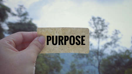 Motivational and inspirational quote - âPURPOSEâ written on a white paper. Vintage styled background.の写真素材