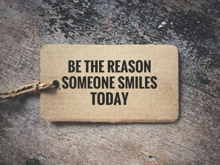 Motivational and inspirational quote - Be the reason someone smiles today. Vintage styled background.の写真素材