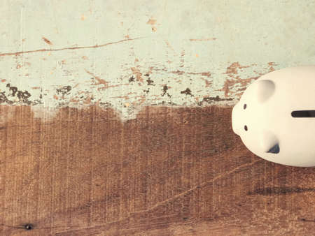 Business and financial concept - A piggy bank placed on a wooden table.の写真素材