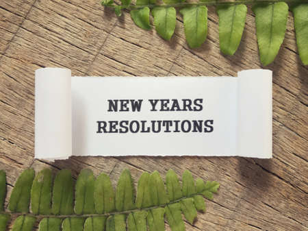 New Year Resolutions concept - New Years Resolutions written on a paper.