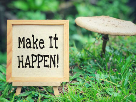 Motivational and inspirational wording - Make It Happen written on framed paper.の写真素材