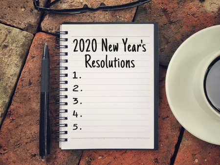 New year resolutions concept - 2020 New Yearâ€™s Resolutions written on a notebook.