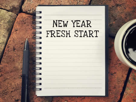 New Year concept - New Year, Fresh Start written on a notebook.の写真素材