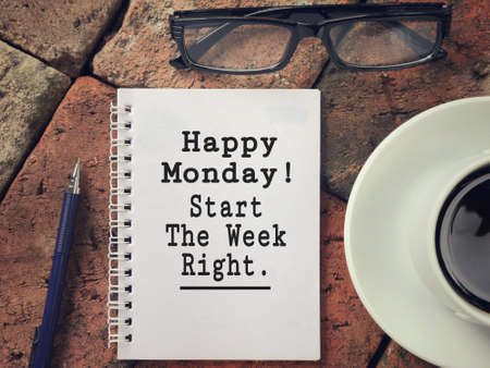 Motivational and inspirational wording - Happy Monday. Start The Week Right written on a notebook.の写真素材