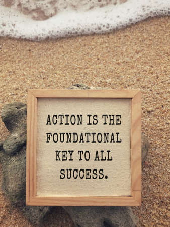 Motivational and inspirational wording - Action Is The Foundational Key To All Succes. Vintage styled background.の写真素材