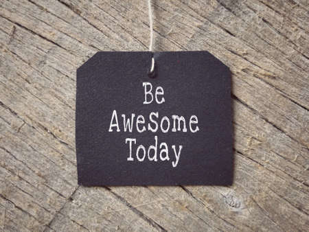 Motivational and inspirational wording - Be Awesome Today written on a paper. Blurred styled background.の写真素材
