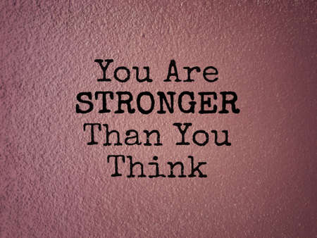 Motivational and inspirational wording - You Are Stronger Than You Think. Blurred styled background.の写真素材