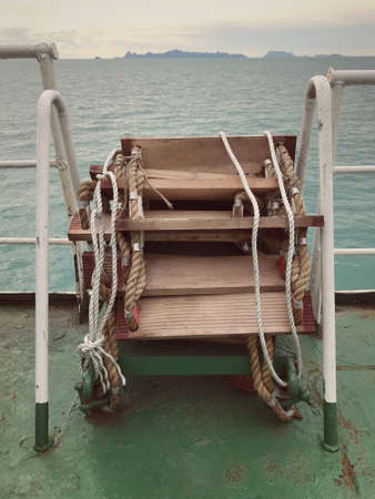 Folded rope ladder on a ship located in Koh Samui, Thailand.の写真素材
