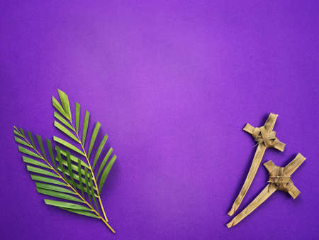 Good Friday, Palm Sunday, Ash Wednesday, Lent Season and Holy Week concept.  Palm leaves and crosses made of palm leaves on purple background.の写真素材
