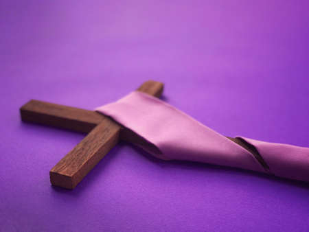 Good Friday, Lent Season, Ash Wednesday and Holy Week concept. A Christian cross on purple background.の写真素材