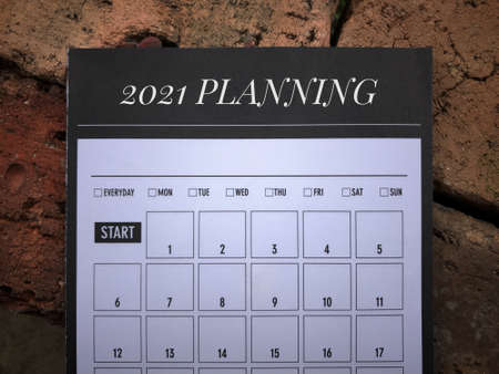 New Year resolution concept. 2021 PLANNING written on a book planner.の写真素材