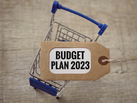 New Year financial plan concept. Budget Plan 2023 written on decorative tag. With background of blurred shopping cart. Vintage and blurred styled background.の写真素材