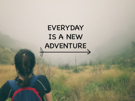 Motivational and inspirational wording. Everyday is a new adventure. Written on blurred vintage styled background.の写真素材