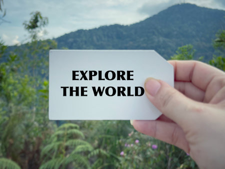Motivational and inspirational wording.Explore the world. Written on blurred vintage styled background.の写真素材