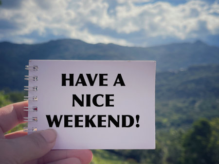 Motivational and inspirational wording. Have A Nice Weekend written on a notepad. With blurred styled background.の写真素材