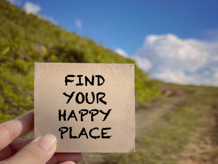 Motivational and inspirational wording. Find Your Happy Place written on a notepad. With blurred styled background.の写真素材