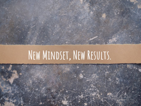 Motivational and inspirational wording. NEW MINDSET, NEW RESULTS written on a ripped paper. With...