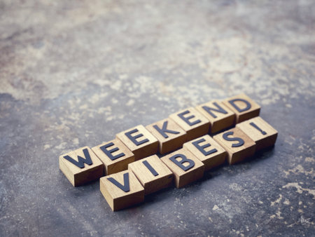 Motivational and inspirational wording. WEEKEND VIBES written on wooden blocks. With blurred styled background.の写真素材