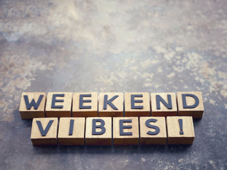 Motivational and inspirational wording. WEEKEND VIBES written on wooden blocks. With blurred styled background.の写真素材