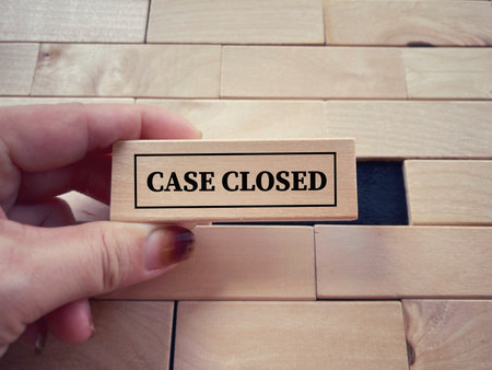 Social issues, law and justice concept. CASE CLOSED written on wooden blocks. With blurred styled...