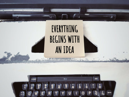 Motivational and inspirational wording. EVERYTHING BEGINS WITH AN IDEA written on blurred styled...