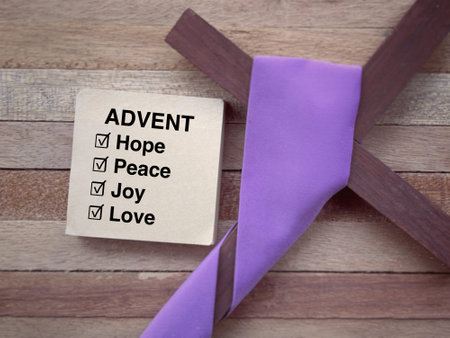 Christianity concept about Advent and Christmas season. ADVENT, Hope, Peace, Love and Joy written on a notepad. With blurred style background.の写真素材