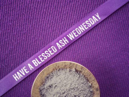 Christianity concept about Ash Wednesday, Good Friday, Lent Season and Holy Week. HAVE A BLESSED ASH WEDNESDAY written on a purple ribbon. With blurred style background.の写真素材