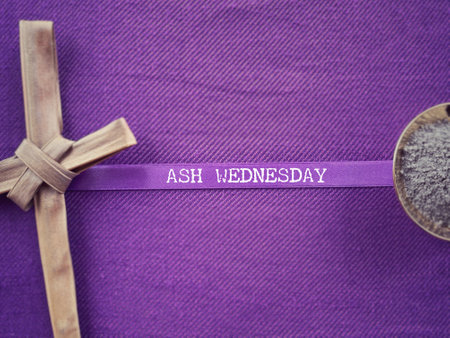 Christianity concept about Ash Wednesday, Good Friday, Lent Season and Holy Week. ASH WEDNESDAY written on a purple ribbon. With blurred style background.の写真素材