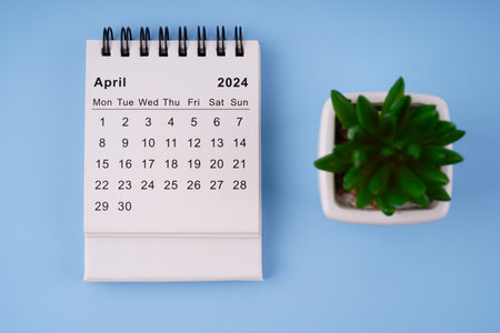 Month, time and calendar concept. Calendar for month of April 2024. On blurred styled background.の写真素材