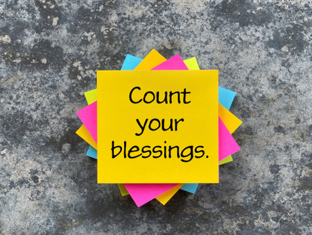 Motivational and inspirational wording. Count Your Blessings written on adhesive paper.