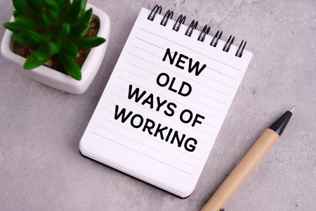 Motivational and inspirational in working concept. NEW OLD WAYS OF WORKING written on a notepad.