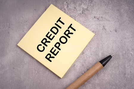 Business and finance concept. CREDIT REPORT written on a notepad.の写真素材