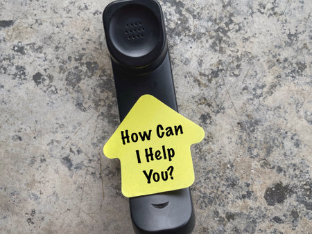 Motivational and inspirational wording. How Can I Help you? written on a paper. Blurred style background.の写真素材