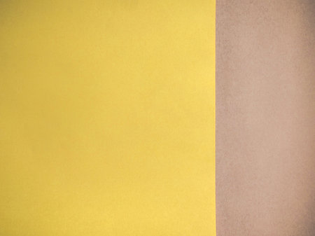 Background and color concept. Paper background in light yellow and brown.の写真素材