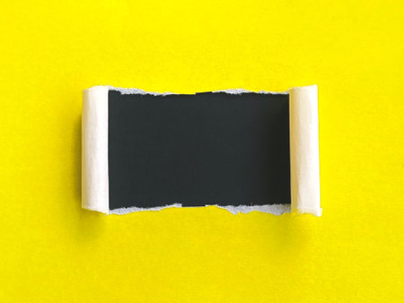 Background and color concept. Colored paper background in yellow and black.の写真素材