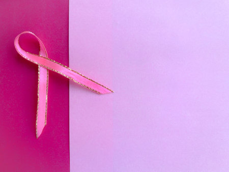 Health and breast cancer awareness month concept. Pink ribbon on pink background.の写真素材