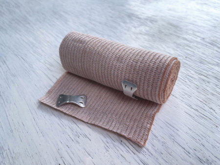 Medical care and health concept. A piece of cohesive bandage on white background.の写真素材