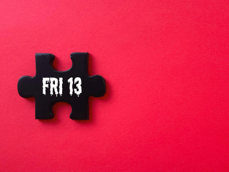 Annual holiday and celebration event. Friday 13 calendar date behind redbackground.の写真素材