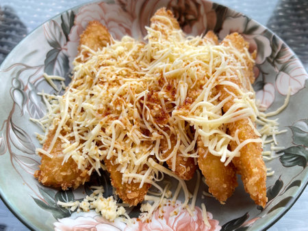 Banana fritters with cheese on a plate in a restaurant.の写真素材