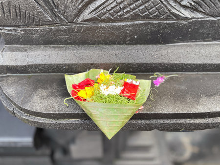 Flower offerings in Bali are a way to show gratitude to the gods and to maintain balance with the divine.の写真素材