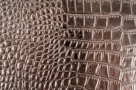 Close up of metallic gold color crocodile skinの写真素材