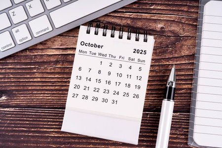 Monthly calendar concept. Flat lay 2025 October desk calendarの写真素材