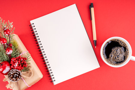 Christmas decorations and empty notebook for copy space on red background. Christmas concept.の写真素材