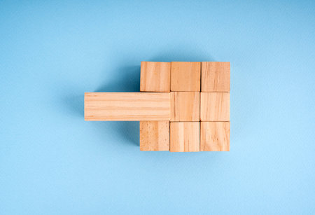 Completed wood blocks with wrong type of block . Building a successful business team conceptの写真素材