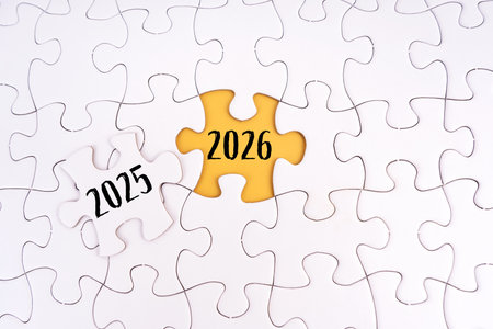 2025 and 2026 written on jigsaw puzzles. New Year conceptの写真素材