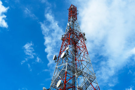 Radio, communication and cell towers on blue sky background