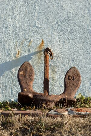 Rusting steel anchor decorates the garden of the Battery Point lighthouse in Crescent City, CA.の写真素材
