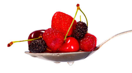 Image of assorted berries in a spoonの写真素材