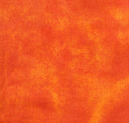 fuzzy orange fabric on the backgroundの写真素材